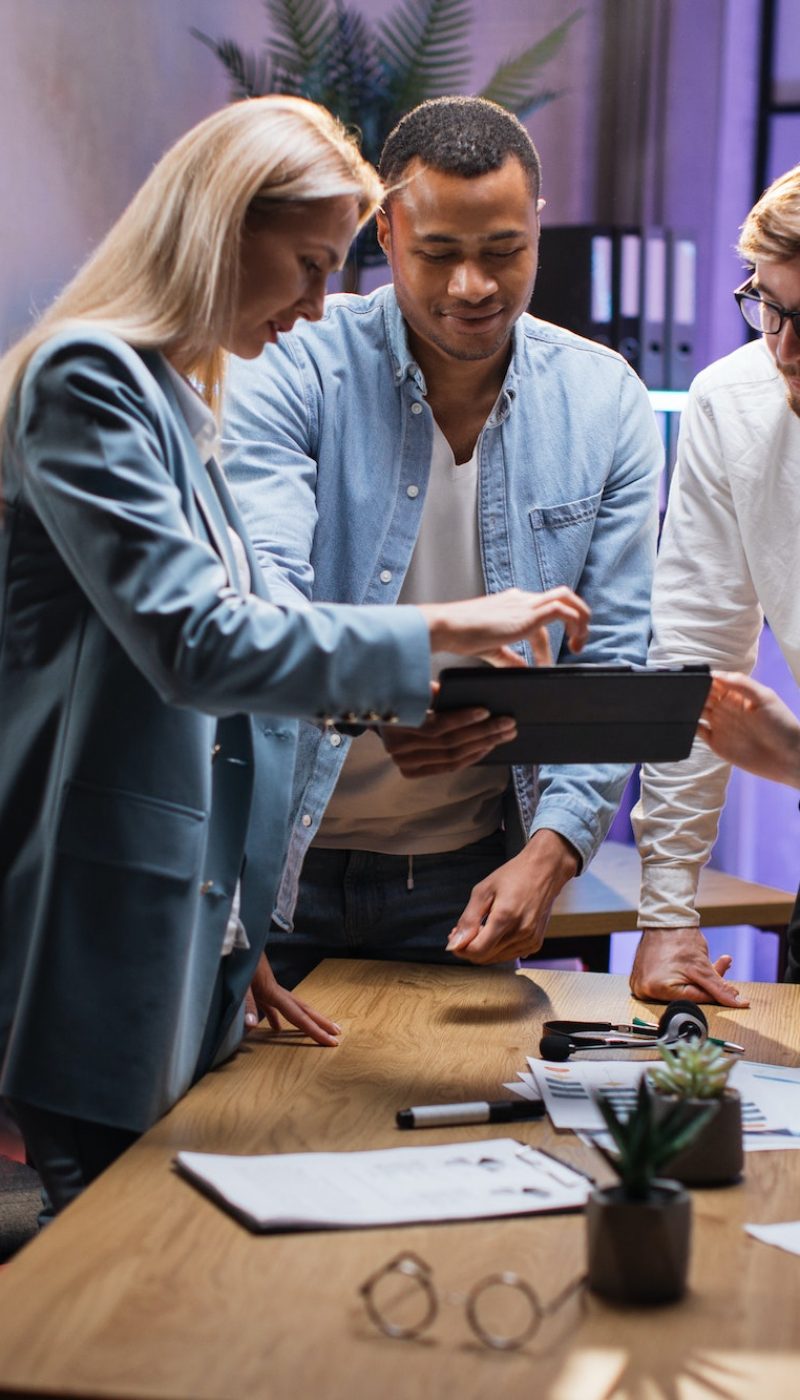 Team of financial experts using tablet during brainstorming Team of financial experts using tablet during brainstorming